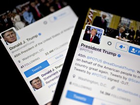 The Twitter Inc. accounts of U.S. President Donald Trump, @POTUS and @realDoanldTrump, are seen on an Apple Inc. iPhone arranged for a photograph in Washington, D.C., U.S., on Friday, Jan. 27, 2017.
