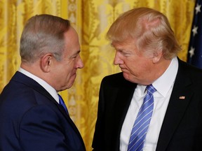 U.S. President Donald Trump greets Israeli Prime Minister Benjamin Netanyahu at the White House in Washington, DC, February 15, 2017.