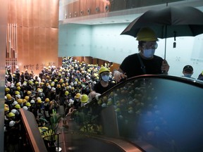 Protesters break into the Legislative Council building during the anniversary of Hong Kong's handover to China in Hong Kong, China July 1, 2019.