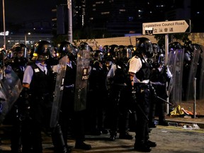 Riot police clear the streets outside the Legislative Council building, after protesters stormed the building on the anniversary of Hong Kong's handover to China, in Hong Kong, China July 2, 2019.