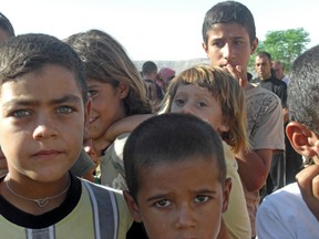 Yazidi children are seen at a makeshift refugee camp, Avro Elementary School, in Duhok, Iraq, in September 2014.