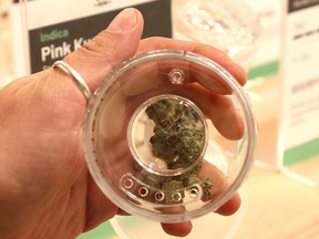 Eugene Konarev, manager and brand creator of Highlife, displays a smell jar holding product at the cannabis retail outlet in Sudbury, Ont. on Friday May 24, 2019.