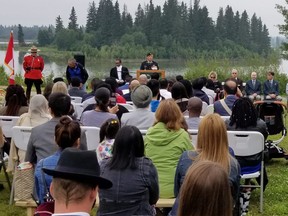 A citizenship ceremony is seen at Elk Island National Park in Alberta.