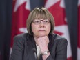 Anne McLellan listens to a question during a news conference in Ottawa on December 13, 2016.