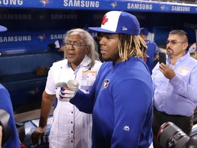 Vladimir Guerrero Jr. #27 of the Toronto Blue Jays talks to his grandmother Alta Gracia Alvino during batting practice prior to MLB game action against the Oakland Athletics at Rogers Centre on April 26, 2019 in Toronto, Canada.