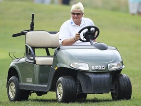John Daly drives his golf cart on the first fairway during the first round of the Barbasol Championship on July 18, 2019 in Nicholasville, Kentucky.