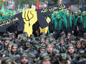 This file photo taken on October 12, 2016 shows members of Lebanon's Shiite movement Hezbollah parading during Ashura commemorations in a southern Beirut suburb.