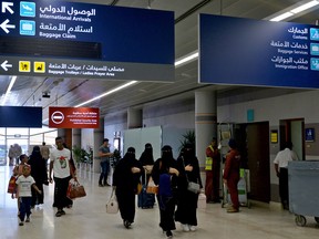 In this photo taken on June 13, 2019 shows Saudi women arriving at Abha airport in the popular mountain resort of the same name in the southwest of Saudi Arabia.
