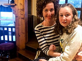 This handout recent picture released by the Quoirin family on August 5, 2019 shows  teenager who went missing from a Malaysian rainforest resort since August 4, Nora Quoirin posing with her mother.