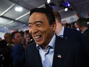 Democratic presidential hopeful U.S. entrepreneur Andrew Yang makes his way through the media room after the second round of the second Democratic primary debate of the 2020 presidential campaign season hosted by CNN at the Fox Theatre in Detroit, Mich., on July 31, 2019.