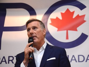 Maxime Bernier, seen speaking at an event on July 11, 2019, has been excluded from the party leaders' debates for the Oct. 21, 2019, federal election.