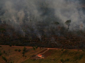 An aerial view of a burning tract of Amazon jungle as it is cleared by loggers and farmers near Porto Velho, Brazil August 29, 2019.