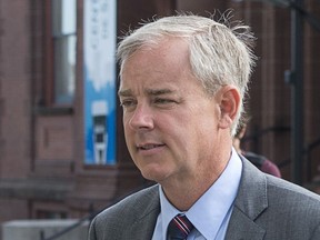 Dennis Oland and his wife Lisa arrive at the Law Courts in Saint John, N.B., on Friday, July 19, 2019. Justice Terrence Morrison of the New Brunswick Court of Queen's Bench will deliver his verdict this morning in the second degree murder trial of Oland, 51, who is charged with beating his father to death on July 6, 2011.