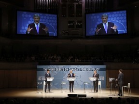 Liberal Leader Justin Trudeau, left to right, Conservative Leader and Prime Minister Stephen Harper and New Democratic Party Leader Thomas Mulcair participate in the Munk Debate on Canada's foreign policy in Toronto, on September 28, 2015. Munk Debates will hold a federal leaders' debate on foreign policy at the beginning of October. The organization, which hosts several debating events a year on varied topics, says the leaders of the Liberals, Conservatives, NDP and Greens are invited to an event in Toronto on Oct. 1.