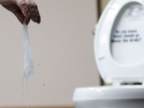 A wipe is tested in Middlesex, N.J., Friday, Sept. 20, 2013. The Competition Bureau of Canada is investigating the marketing practices of companies that make so-called "flushable" wipes. THE CANADIAN PRESS/AP Photo/Julio Cortez)