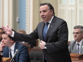 Quebec Premier Francois Legault responds to the opposition during question period on June 5, 2019 at the legislature in Quebec City. Quebec Premier Francois Legault says many industries across the province are having trouble finding workers because they aren't paying enough. Legault was responding today to pleas from business groups for the government to significantly increase annual immigration to the province.