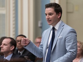 Quebec Minister of Immigration, Diversity and Inclusiveness Simon Jolin-Barrette speaks on June 12, 2019 at the legislature in Quebec City. Quebec's immigration minister says the province is resettling more than its faire share of international refugees.