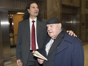 The editor of a hate-filled Toronto-based publication has been jailed for one year. James Sears, left, and LeRoy St. Germaine leave court after being found guilty of promoting hate in Toronto on, Jan. 24, 2019.