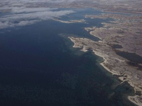 Canadian archeologists are on their way to a remote area in the Arctic Circle for another chance to dig up the secrets held by the Franklin expedition wrecks, Parks Canada announced Friday. Terror Bay, where the sunken ship the HMS Terror lies, is seen from the air near Gjoa Haven, Nvt., on Sept. 3, 2017.
