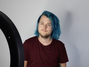 A Canadian is among a group of LGBTQ content creators who have launched a class action lawsuit against YouTube in the United States alleging the popular video-sharing website is censoring their content. Chase Ross is seen near his recording equipment in his Montreal home on Thursday, Aug. 15, 2019.