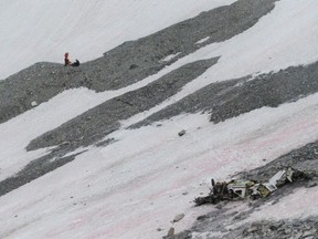 The wreckage of a plane crash in the Kananaskis area of Alberta is seen in this undated handout photo. A lack of oxygen likely played a role in a plane crash southwest of Calgary that killed two people, an investigation by the Transportation Safety Board of Canada found. The board said in a report released Thursday that hypoxia, or in-flight oxygen deprivation, caused the pilot to lose control before the plane crashed into rugged terrain in the Kananaskis area of Alberta on Aug. 1, 2018.