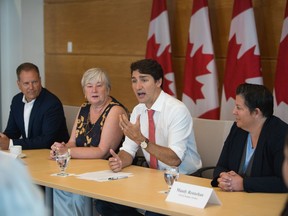 Prime Minister Justin Trudeau hosts a roundtable discussion on supporting young women in science, trades, and technology occupations as (L-R) Darren Fisher, MP for Dartmouth, Bernadette Jordan, Minister of Rural Economic Development and Mandy Rennehan CEO and founder of Freshco look on at Nova Scotia Community College in Dartmouth, Nova Scotia on Friday, August 16, 2019.
