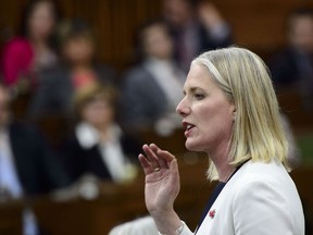 Minister of Environment and Climate Change Catherine McKenna stands during question period in the House of Commons on Parliament Hill in Ottawa on Tuesday, June 18, 2019. Ottawa is pushing back against the Saskatchewan government's request to delay its Supreme Court of Canada hearing into the constitutionality of a federal carbon tax.
