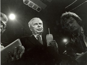 Glass of milk in hand, John Diefenbaker confers with reporters after the 1979 victory of the government of Joe Clark — the first Progressive Conservative election victory since he was party leader. Diefenbaker died on Aug. 16, 1979.