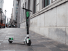 A Lime e-scooter left on the sidewalk in Old Montreal.