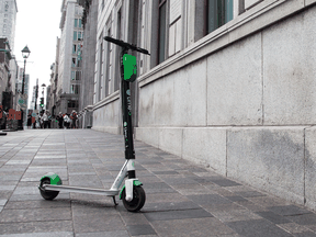 A Lime e-scooter left on the sidewalk in Old Montreal.
