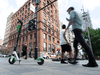 A Lime e-scooter left on the sidewalk in Old Montreal.