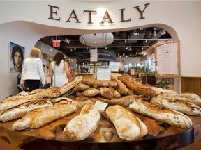 Freshly baked bread displayed at the entrance of an Eataly in New York.