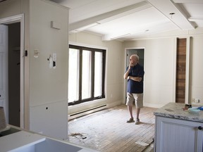 Roland Gariepy stands in a room of his mobile home in Sainte-Marthe-sur-le-Lac, Que., Friday, Aug. 16, 2019. Gariepy's home suffered major damage during spring flooding and will be tore down in the coming days.