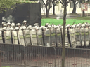 This screengrab taken from an undated video from China's People's Liberation Army Hong Kong Garrison shows soldiers marching and firing during an 