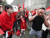 Pro-China counter-protesters, wearing red, shout down a man in a black shirt during an anti-extradition rally for Hong Kong in Vancouver on Aug. 17, 2019.