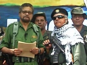 This TV grab taken from YouTube and released on August 29, 2019 shows former senior commander Ivan Marquez(L) and fugitive rebel colleague, Jesus Santrich(wearing sunglass), of the dissolved FARC rebel army group in Colombia.