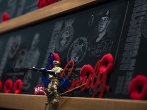 A toy soldier, placed by the daughter of Pte. David Robert James Byers, adorns his plaque on the Kandahar cenotaph in the Afghanistan Memorial Hall following its rededication ceremony at National Defence Headquarters in Ottawa on Saturday, Aug. 17, 2019.