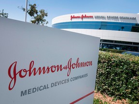 An entry sign to the Johnson & Johnson campus displays the company logo in Irvine, Calif., on Aug. 28, 2019. A court has ordered the drugmaker to pay the state of Oklahoma $572.1 million.