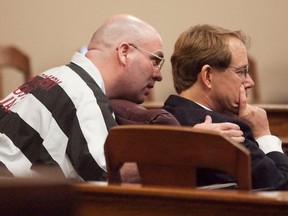 Larry Ray Swearingen speaks to one of his attorneys, James Rytting, during an evidence hearing in 2012.