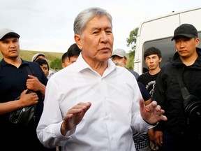 Kyrgyz former President Almazbek Atambayev, stripped of legal immunity after a parliamentary vote, and his supporters attend a meeting with journalists in the village of Koy-Tash near Bishkek, Kyrgyzstan June 27, 2019.