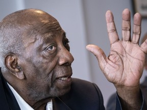 Dan Philip, president of the Black Coalition of Quebec, responds to a question during a news conference in Montreal on Tuesday, August 13, 2019. A Quebec Superior Court judge has authorized a class action lawsuit against the City of Montreal on behalf of citizens who allege they were unfairly arrested and racially profiled by the city's police.