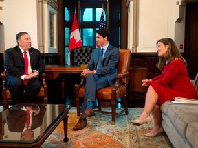 Canadian Prime Minister Justin Trudeau (C), with Foreign Minister Chrystia Freeland (R), meets with US Secretary of State Mike Pompeo on August 22, 2019, in Ottawa.