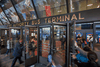 Commuters enter the Port Authority Bus Terminal in New York, April 2, 2014.