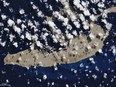A "pumice raft" is seen floating in the South Pacific Ocean after an underwater volcano eruption produced the porous rocks.