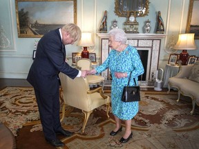 Queen Elizabeth II welcomes newly elected leader of the Conservative party, Boris Johnson during an audience where she invited him to become Prime Minister and form a new government in Buckingham Palace on July 24, 2019 in London, England.