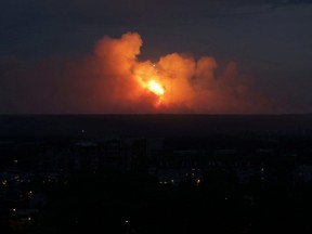 A view shows flame and smoke rising from the site of blasts at an ammunition depot near the town of Achinsk in Krasnoyarsk region, Russia August 5, 2019.