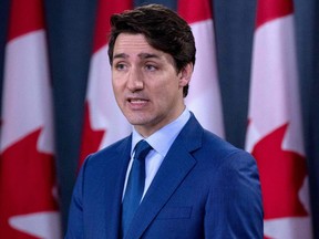 In this file photo taken on March 7, 2019 Canadian Prime Minister Justin Trudeau speaks to the media at the national press gallery in Ottawa, Ontario