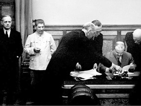 German Nazi Foreign Minister Joachim Von Ribbentrop (L), Soviet head of state Joseph Stalin (2nd L) and his Foreign Minister Vyacheslav Molotov (R) are seen on 23 August 1939 in Kremlin in Moscow during the signing of the Treaty of Non-aggression between Germany and the Union of Soviet Socialist Republics, making the outbreak of war virtually inevitable.