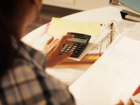 A woman files her taxes.