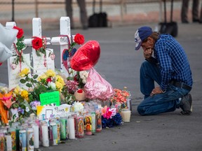 Antonio Basco visits at a makeshift memorial for victims of a mass shooting at a Walmart in El Paso, Texas, Aug. 6, 2019. When his wife was killed in the El Paso shooting this month, Basco lost not only his spouse of 22 years, but also his only relative.